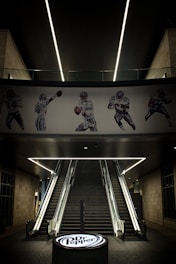 A stairwell with a football mural on the wall