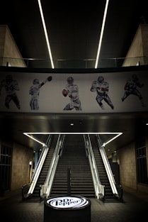 A stairwell with a football mural on the wall