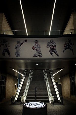 A stairwell with a football mural on the wall