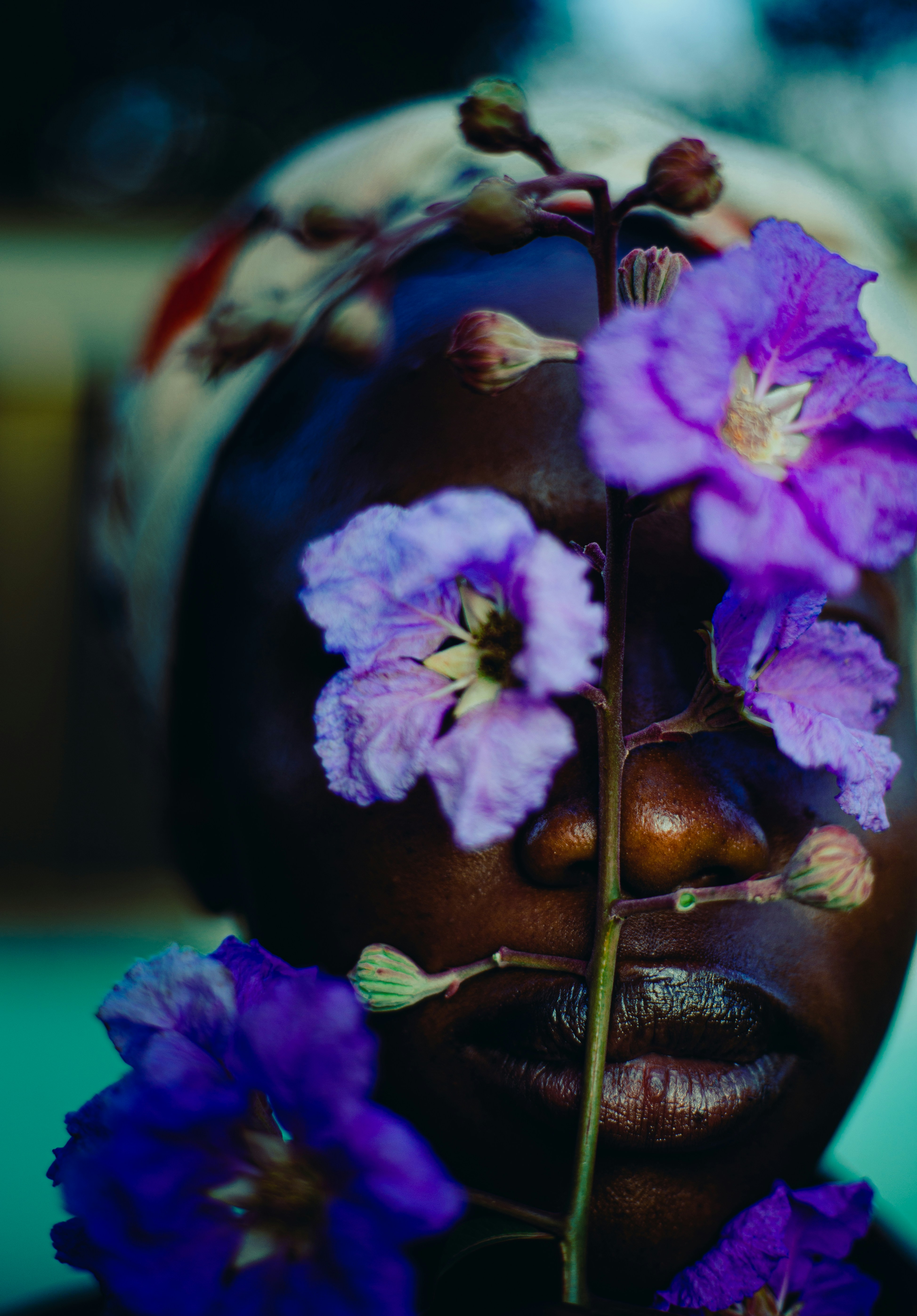 A woman with purple flowers on her face
