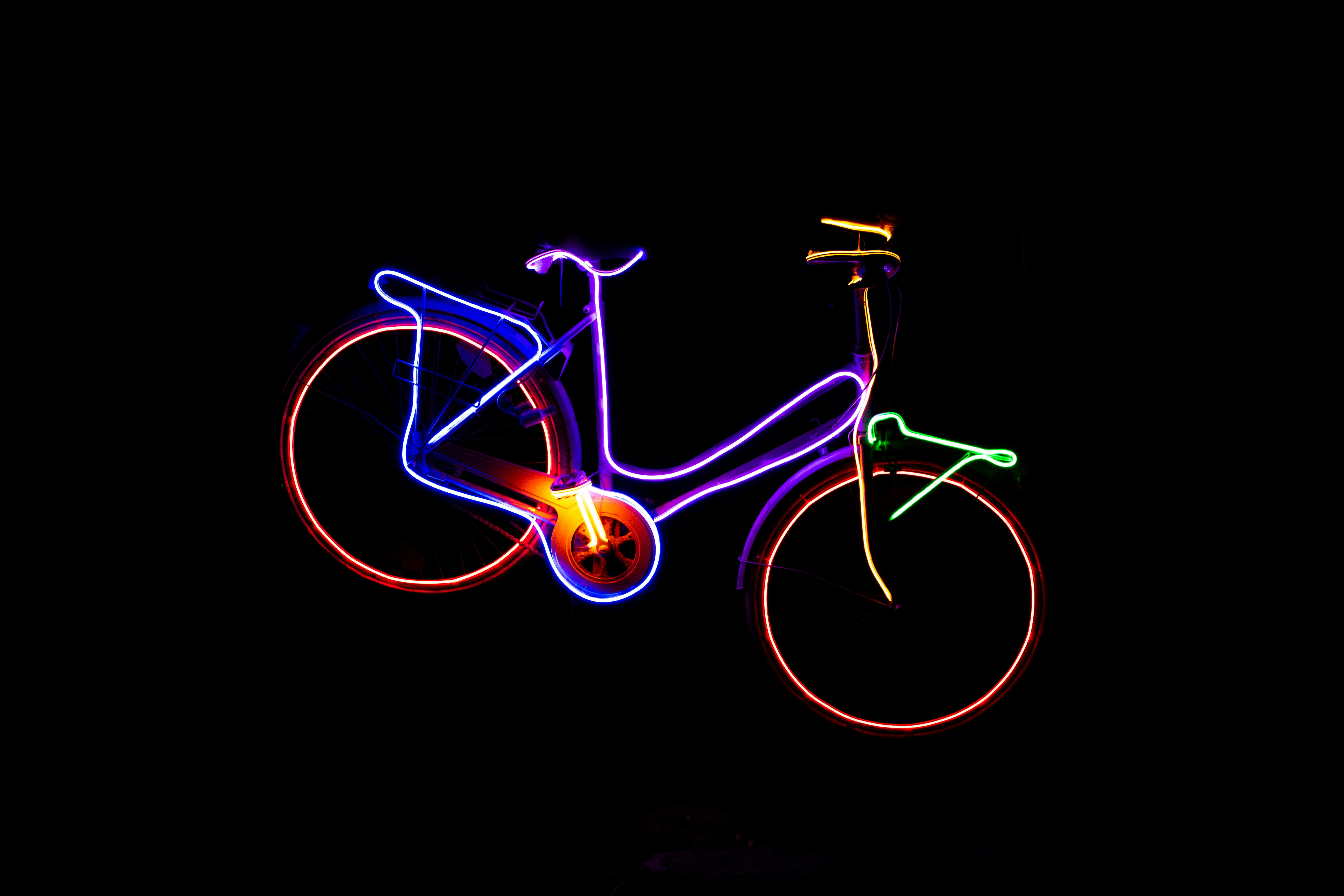 A blurry image of a bicycle in the dark