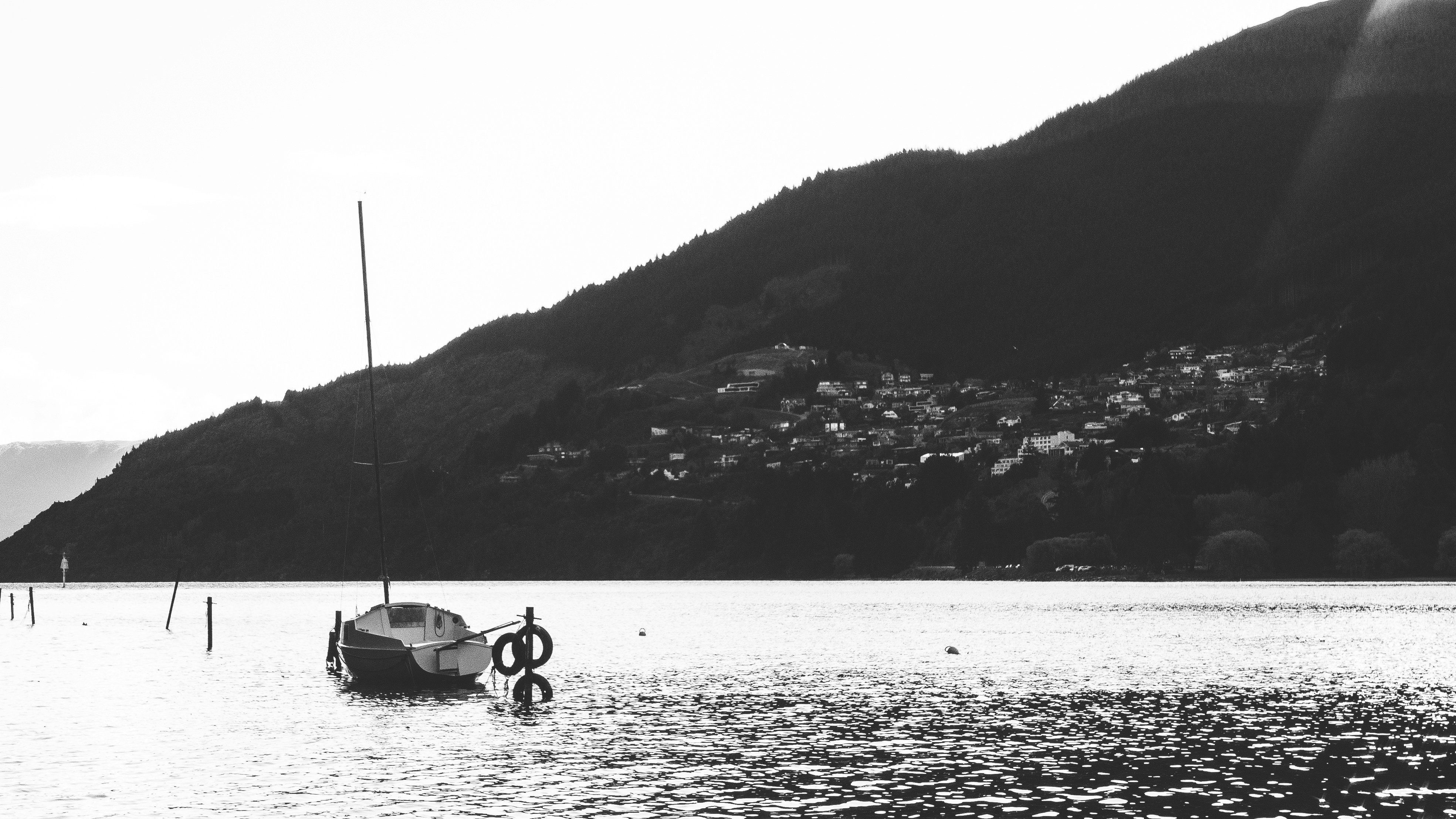 A boat floating on top of a large body of water