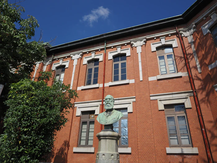 University building with a statue in front