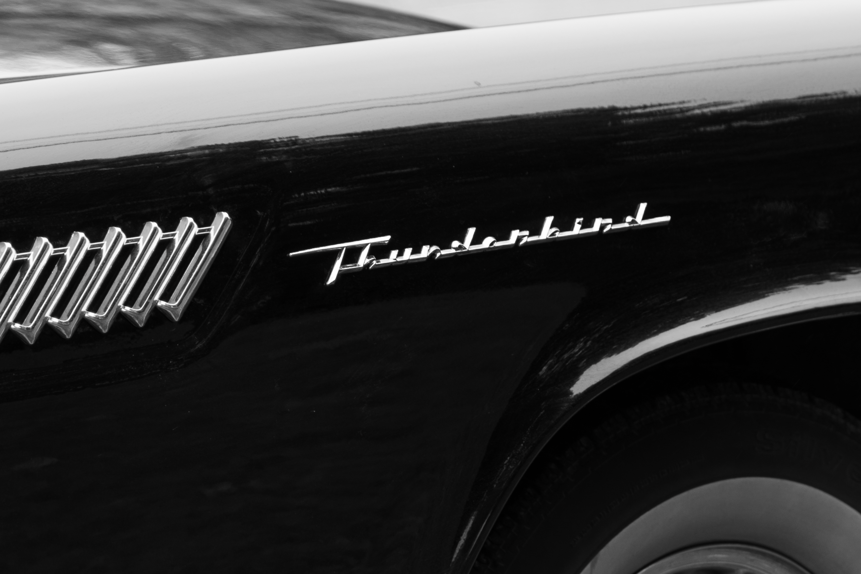 A black and white photo of a black and white car