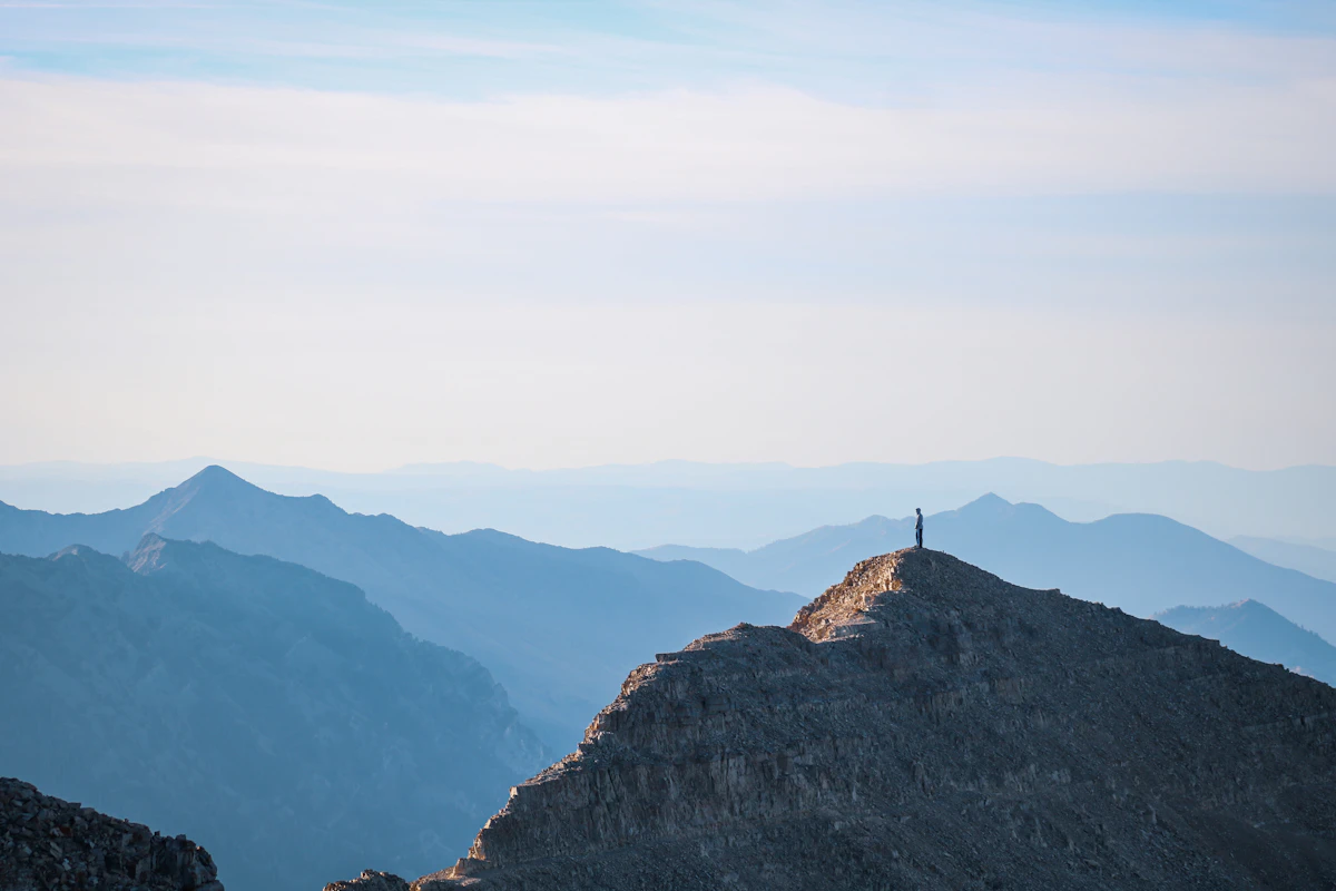 A person standing on top of a mountain