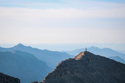 A person standing on top of a mountain