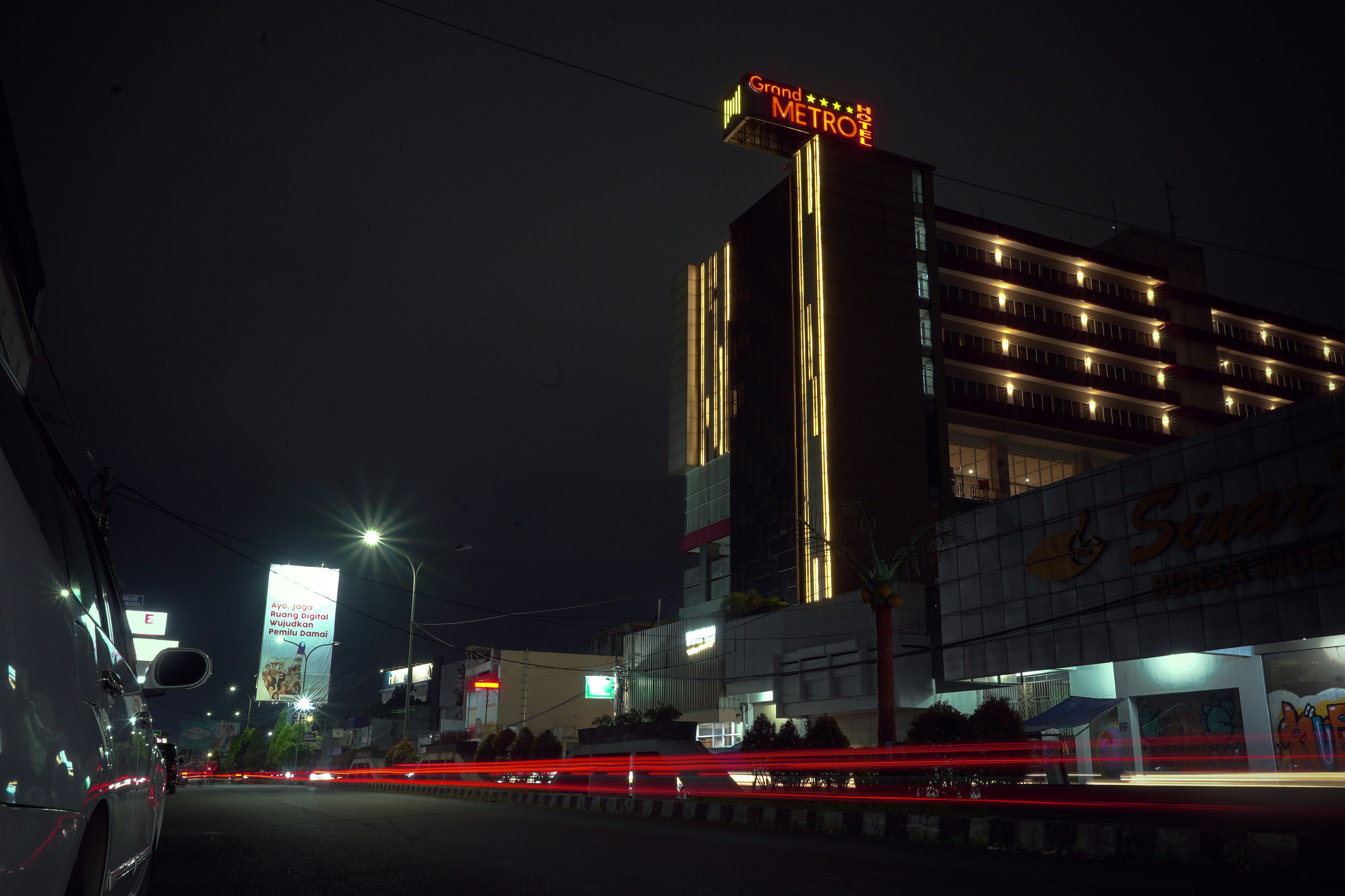 A night shot of a hotel in the city