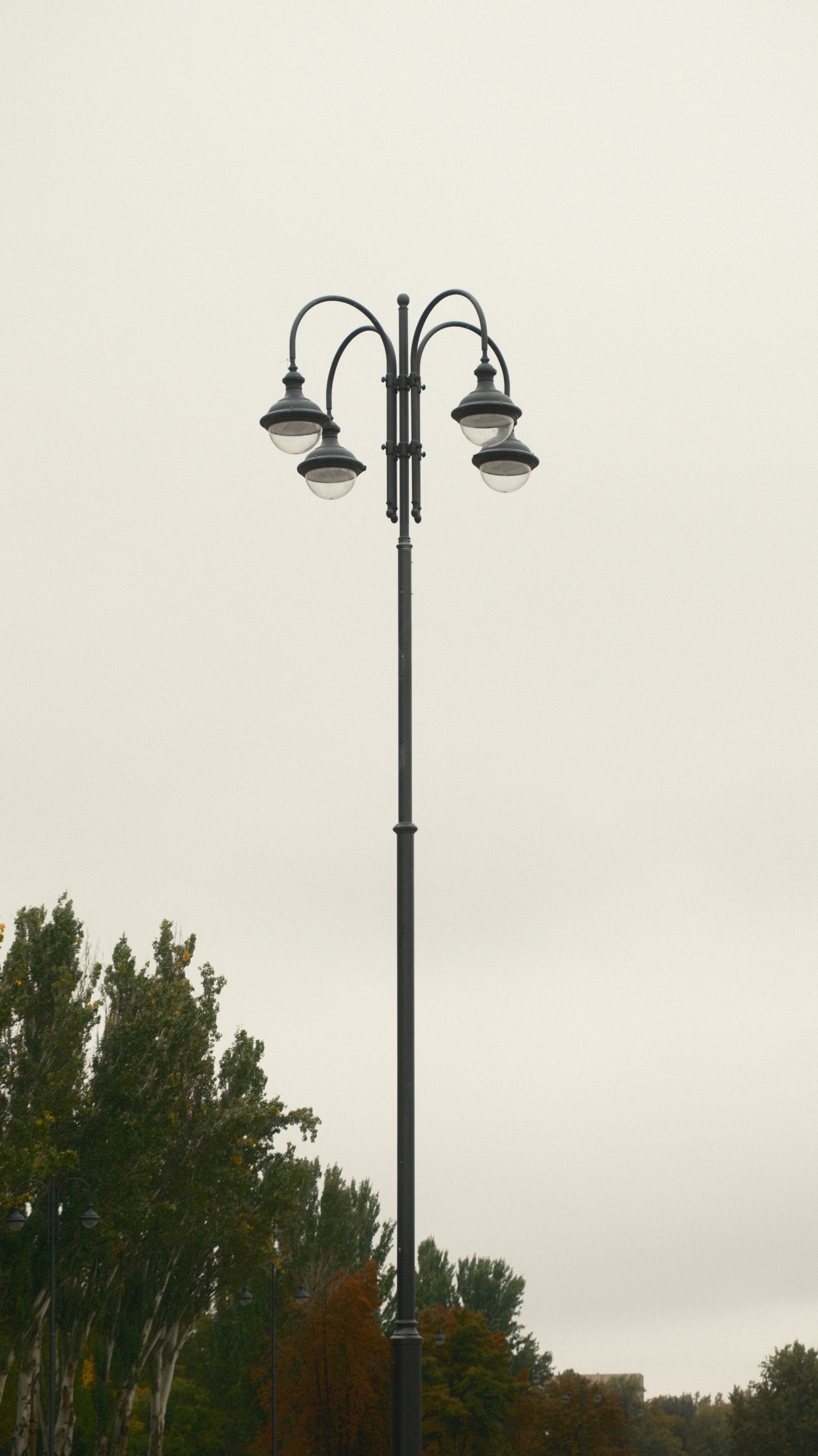A couple of street lights sitting on the side of a road