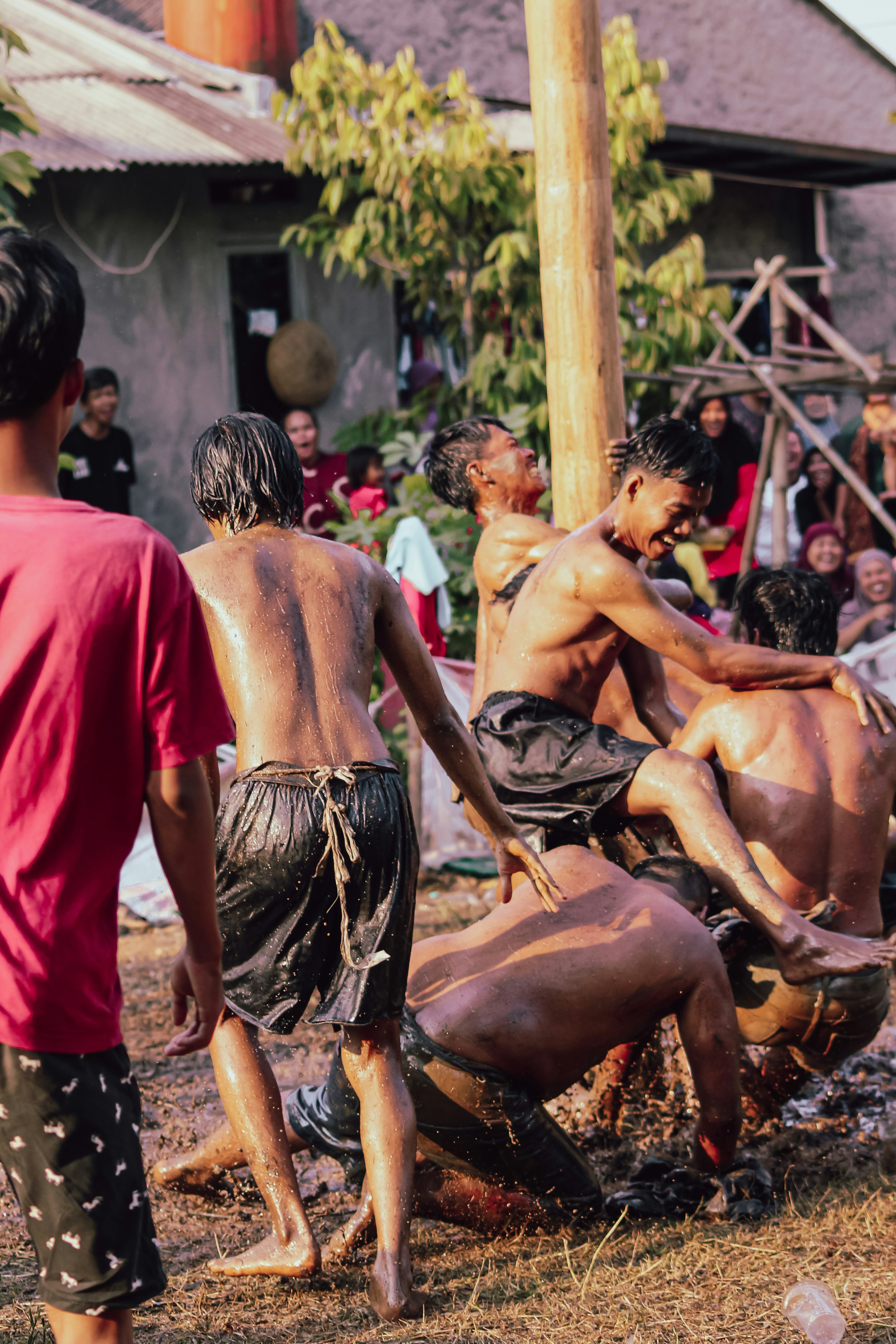 A group of people standing around a man on a horse