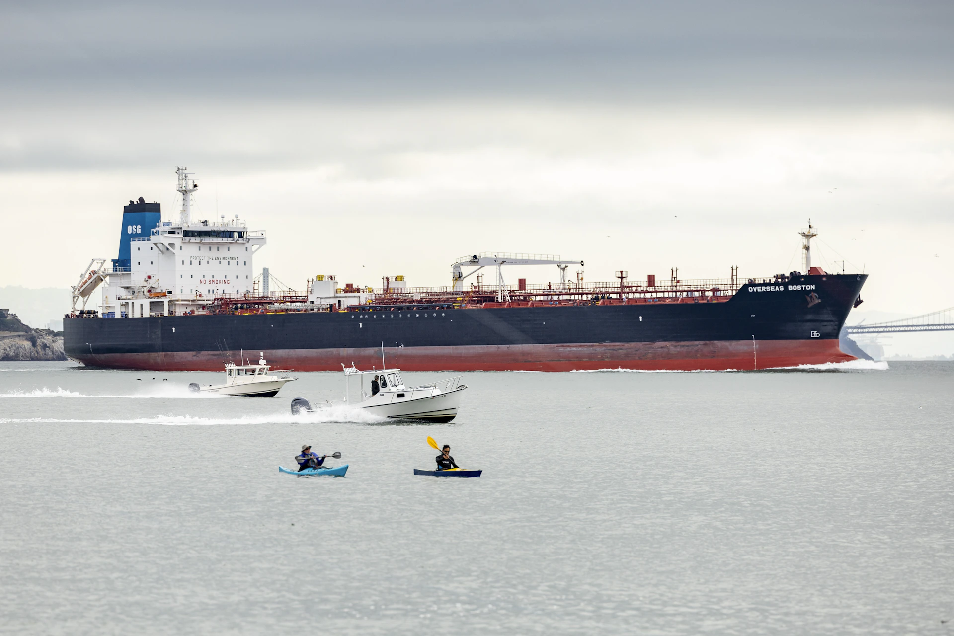 A large cargo ship in the middle of a body of water