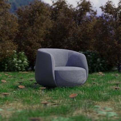 A grey chair sitting on top of a lush green field