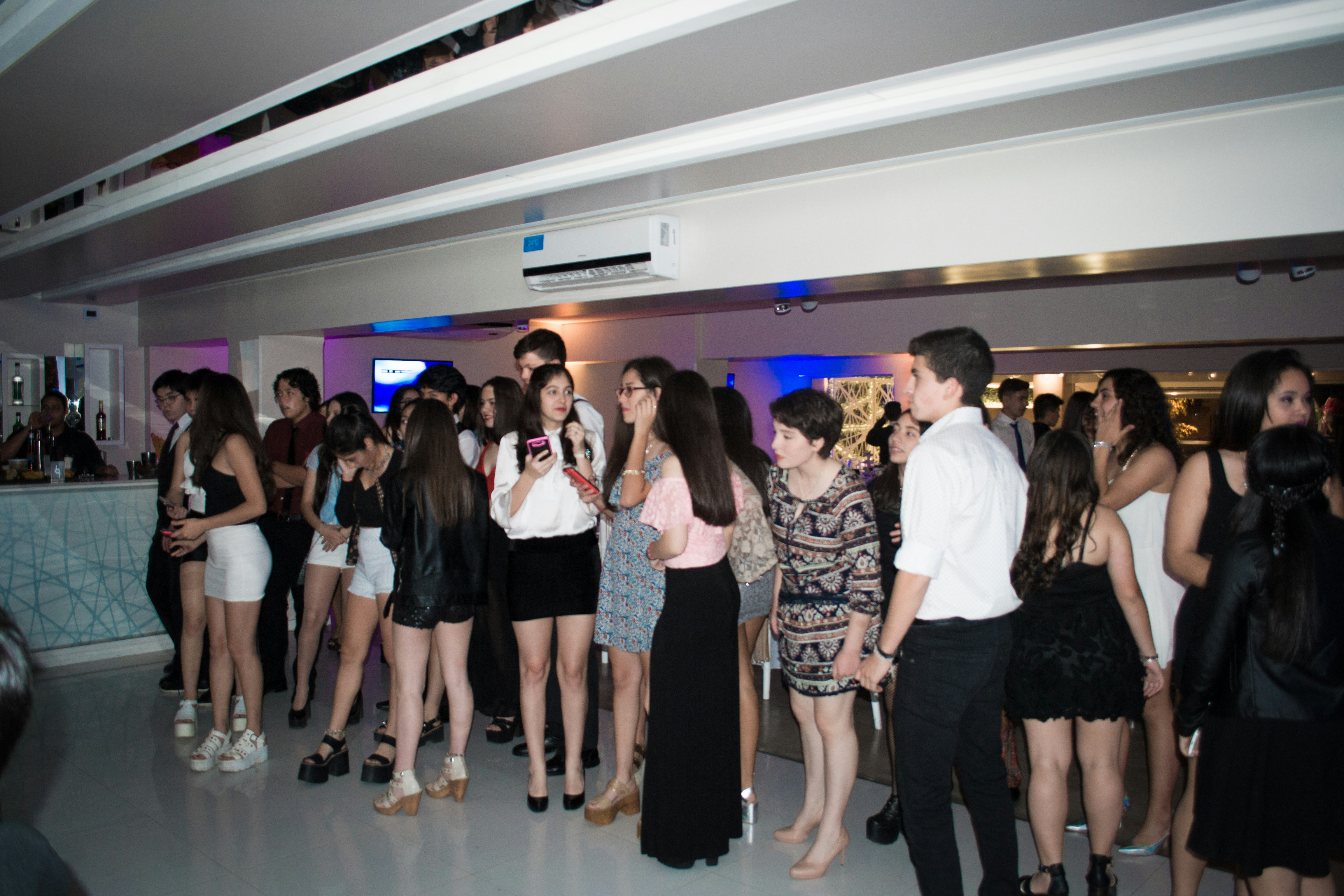 A group of people standing in a room