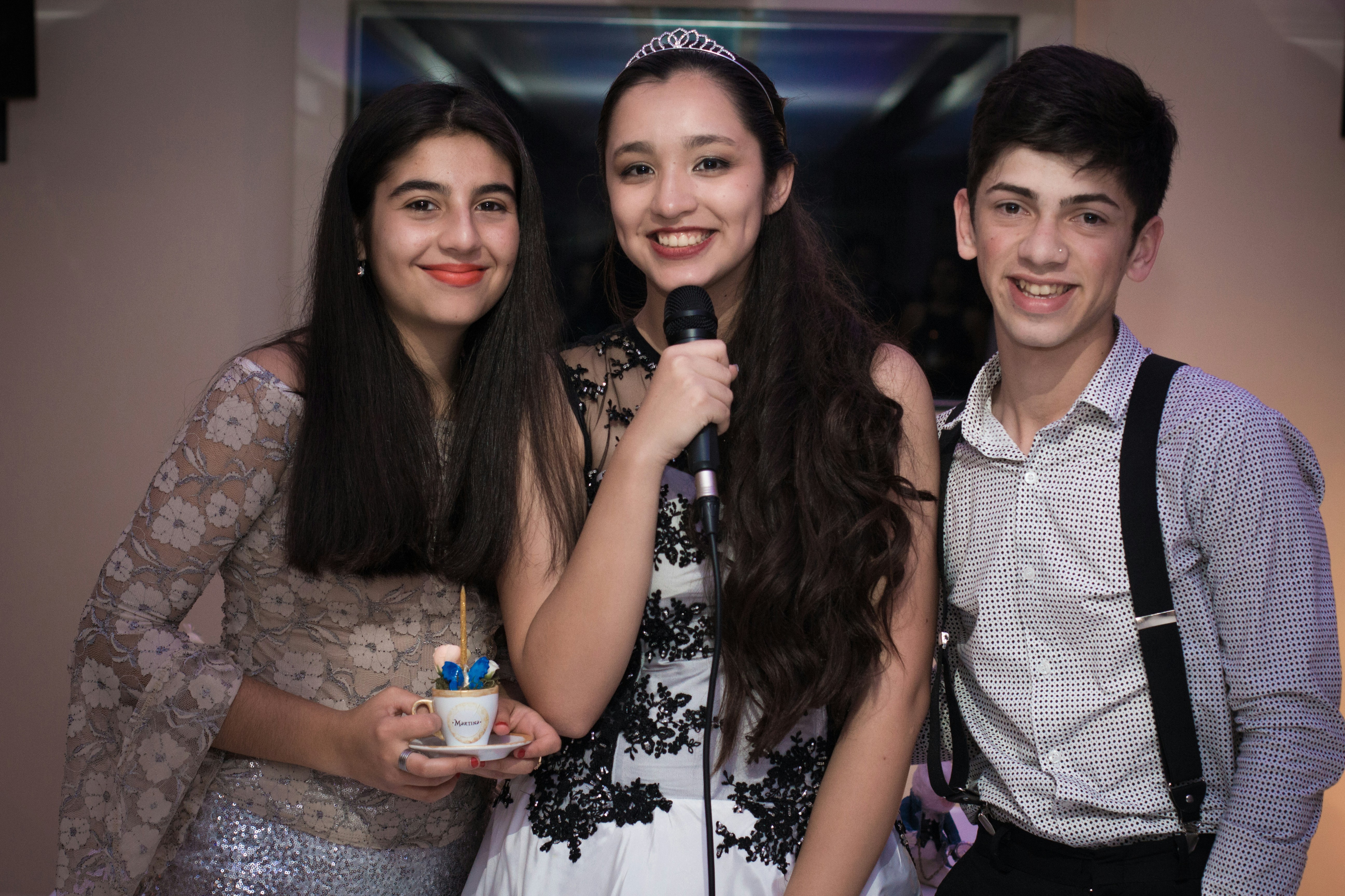 A group of young people standing next to each other