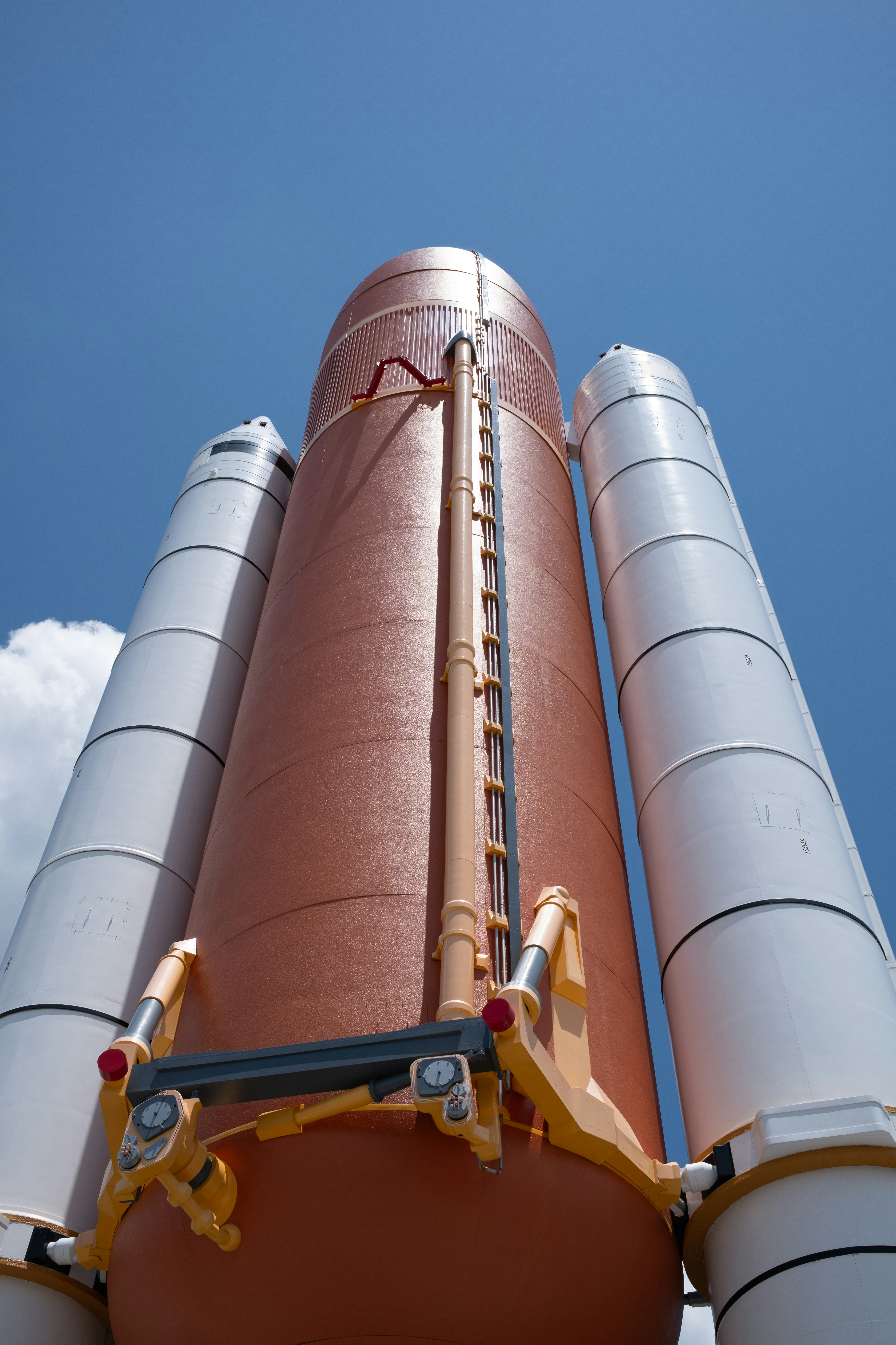 A giant hot dog sitting on top of a metal structure