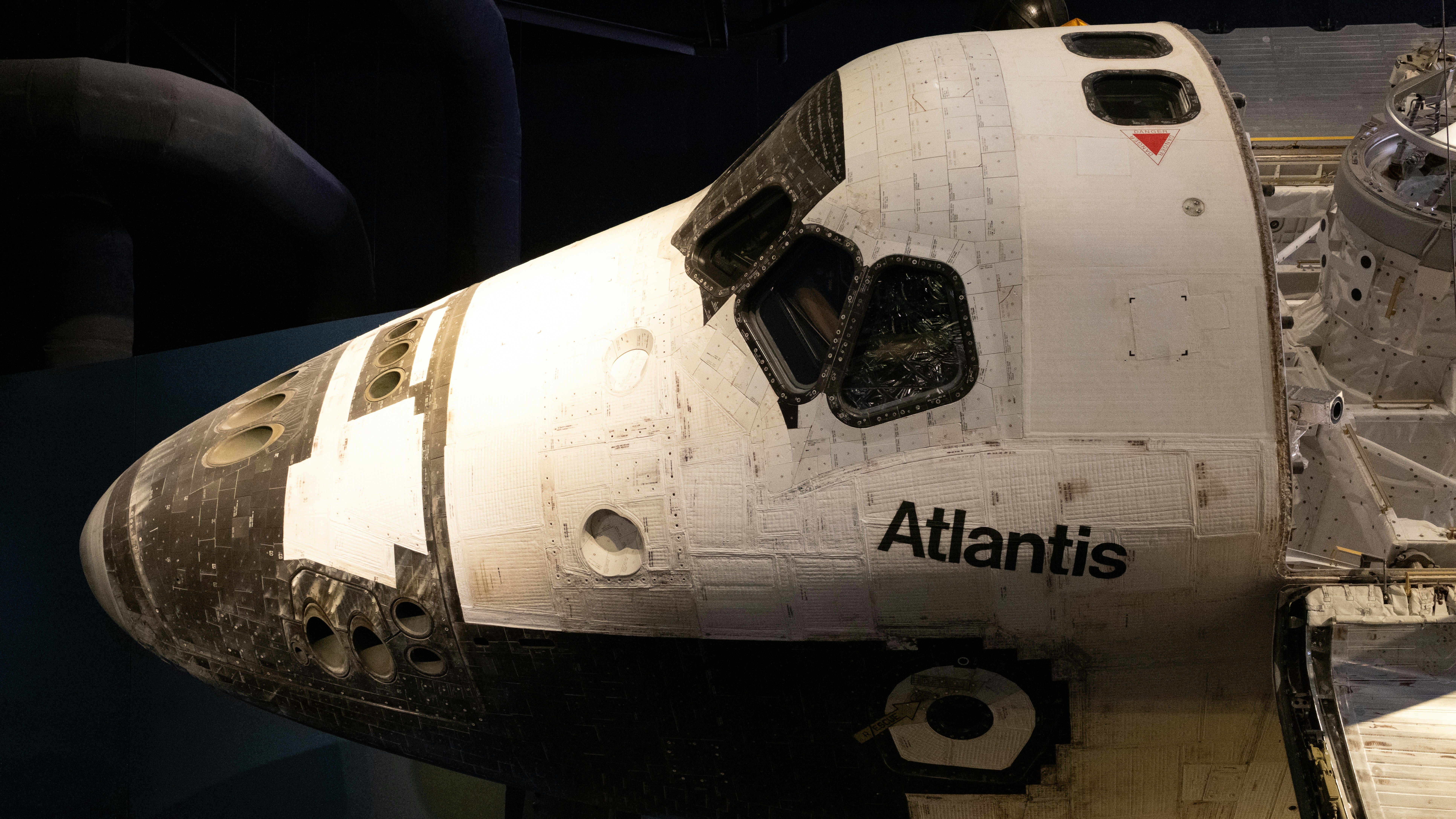 The space shuttle is on display in a museum