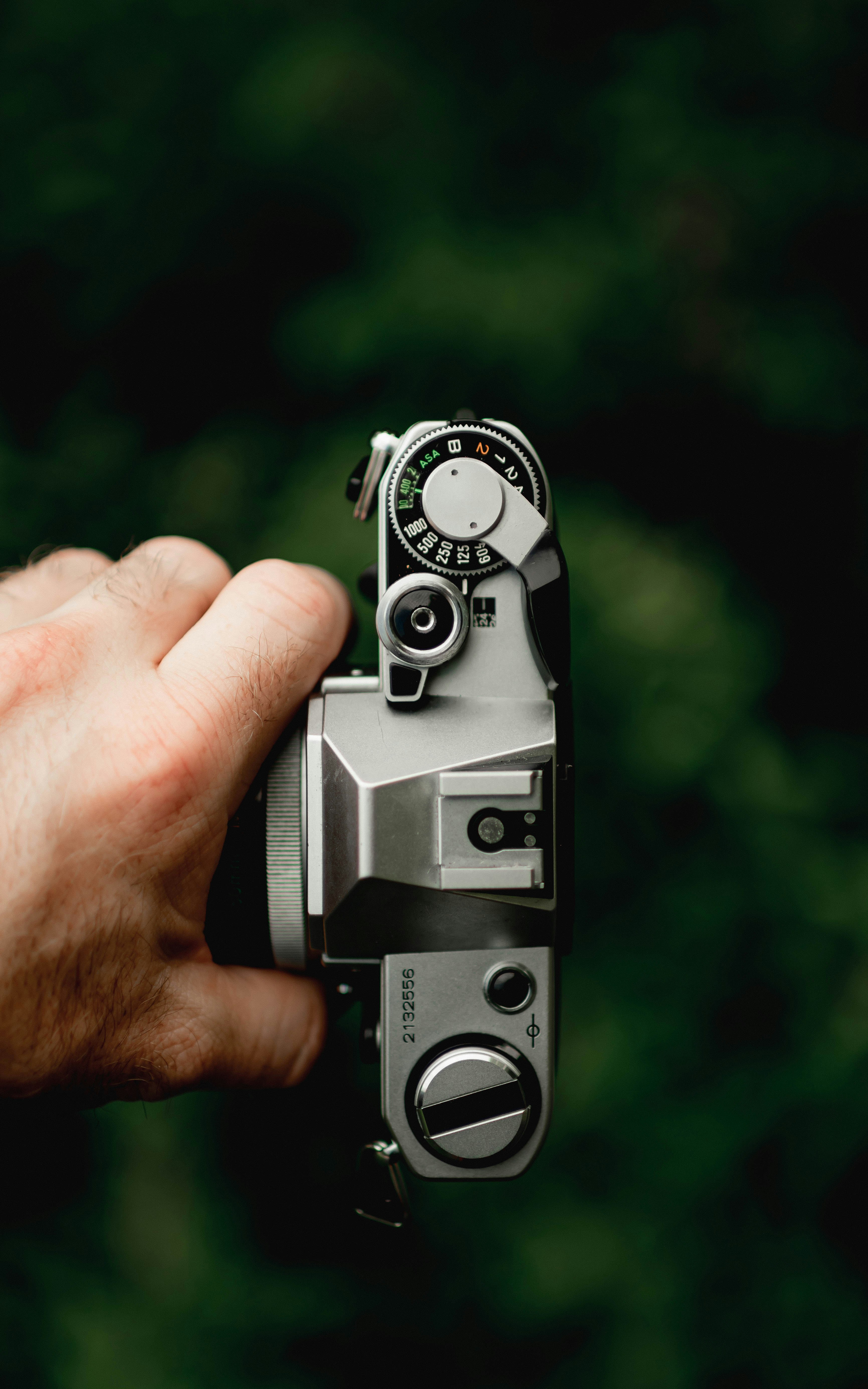 A person holding a camera in their hand