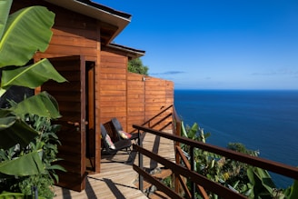 A balcony with a view of the ocean