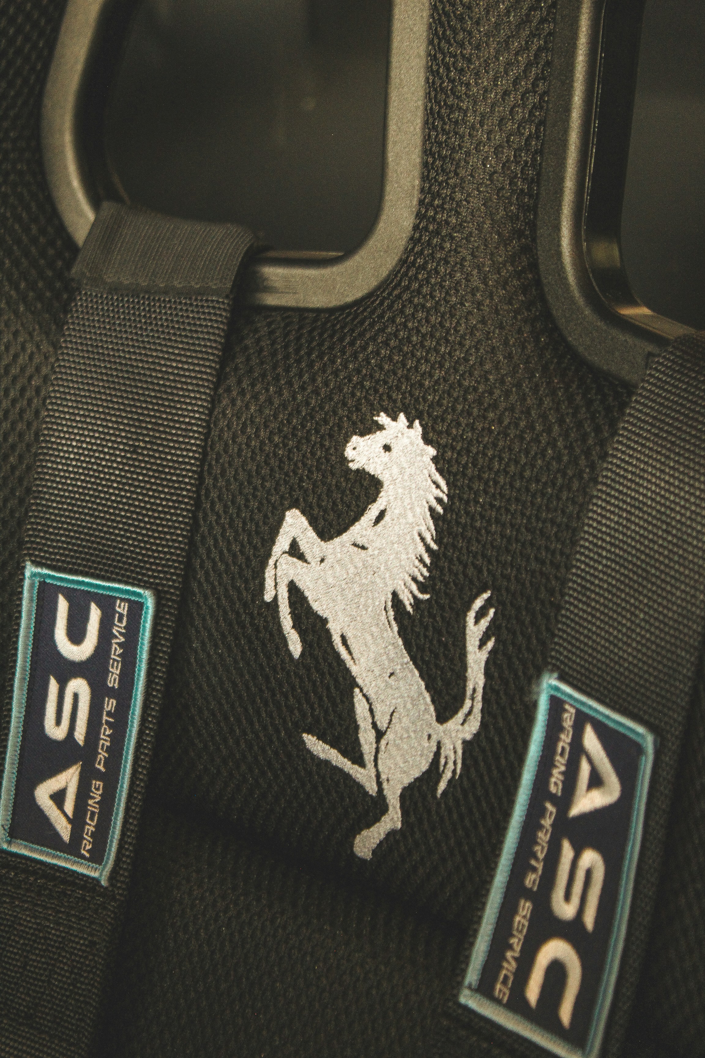 A close up of a bag with a horse on it
