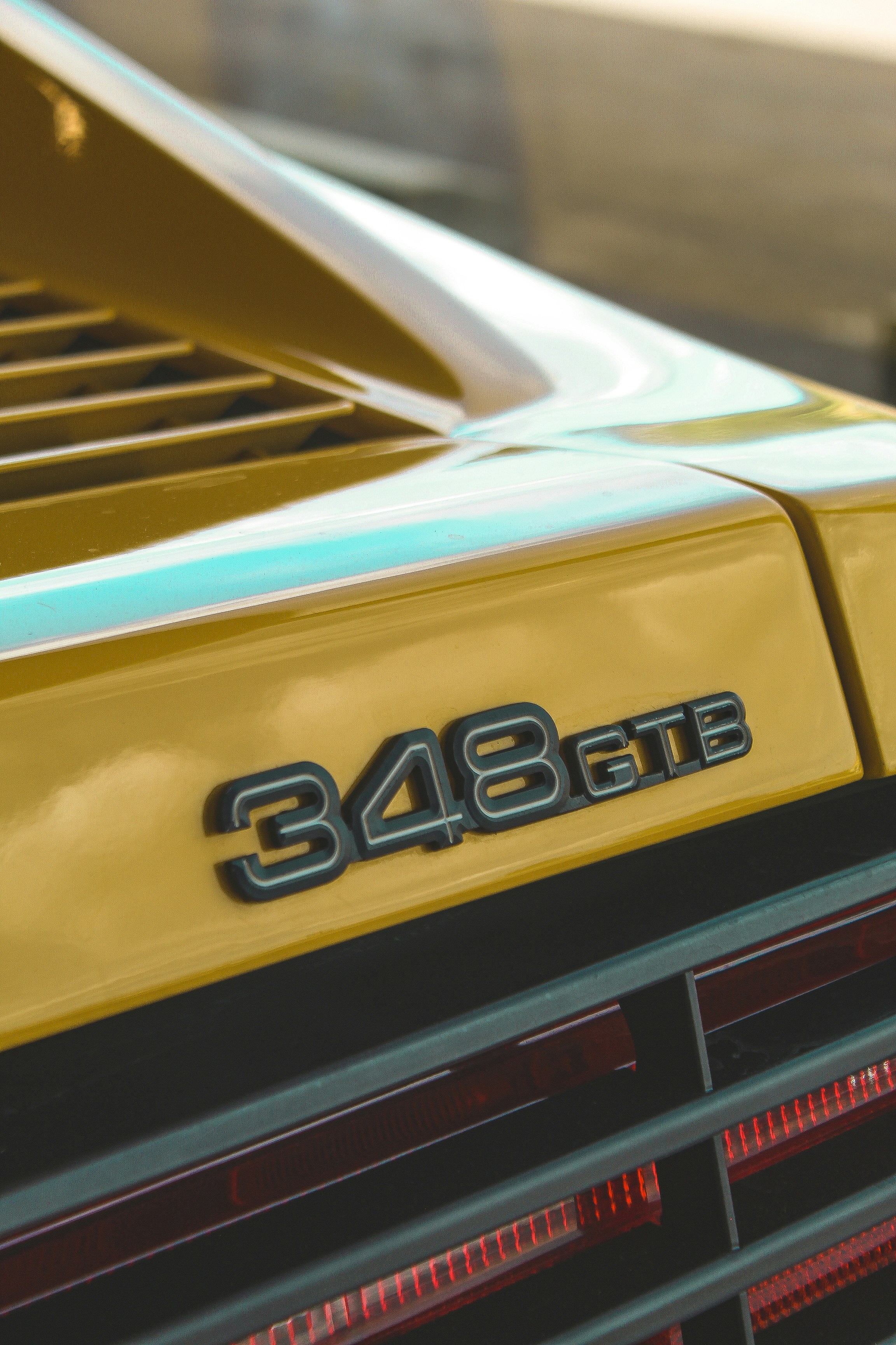 A close up of the front of a yellow sports car