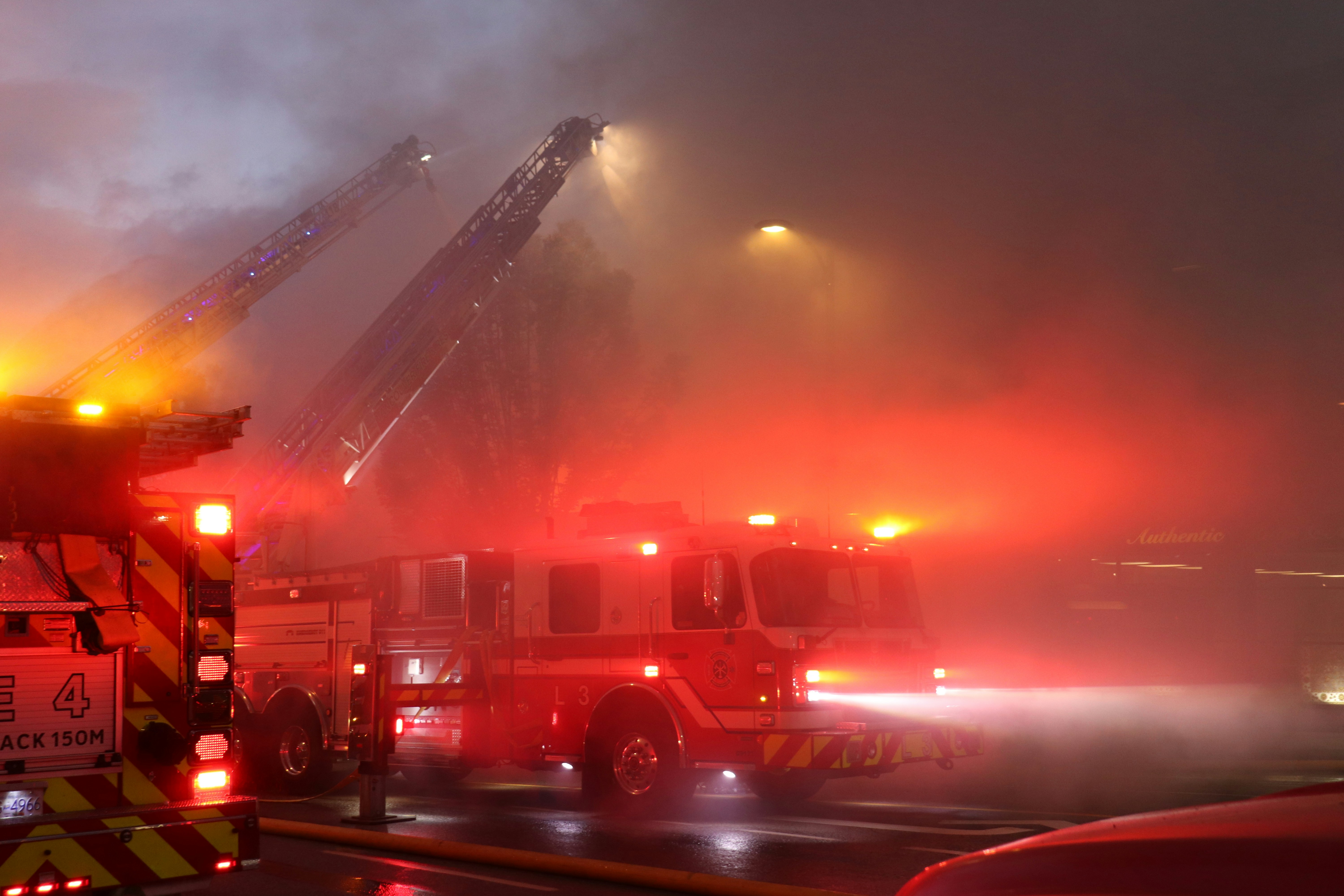 A firetruck with its lights on at night photo – Free Firemen Image on ...
