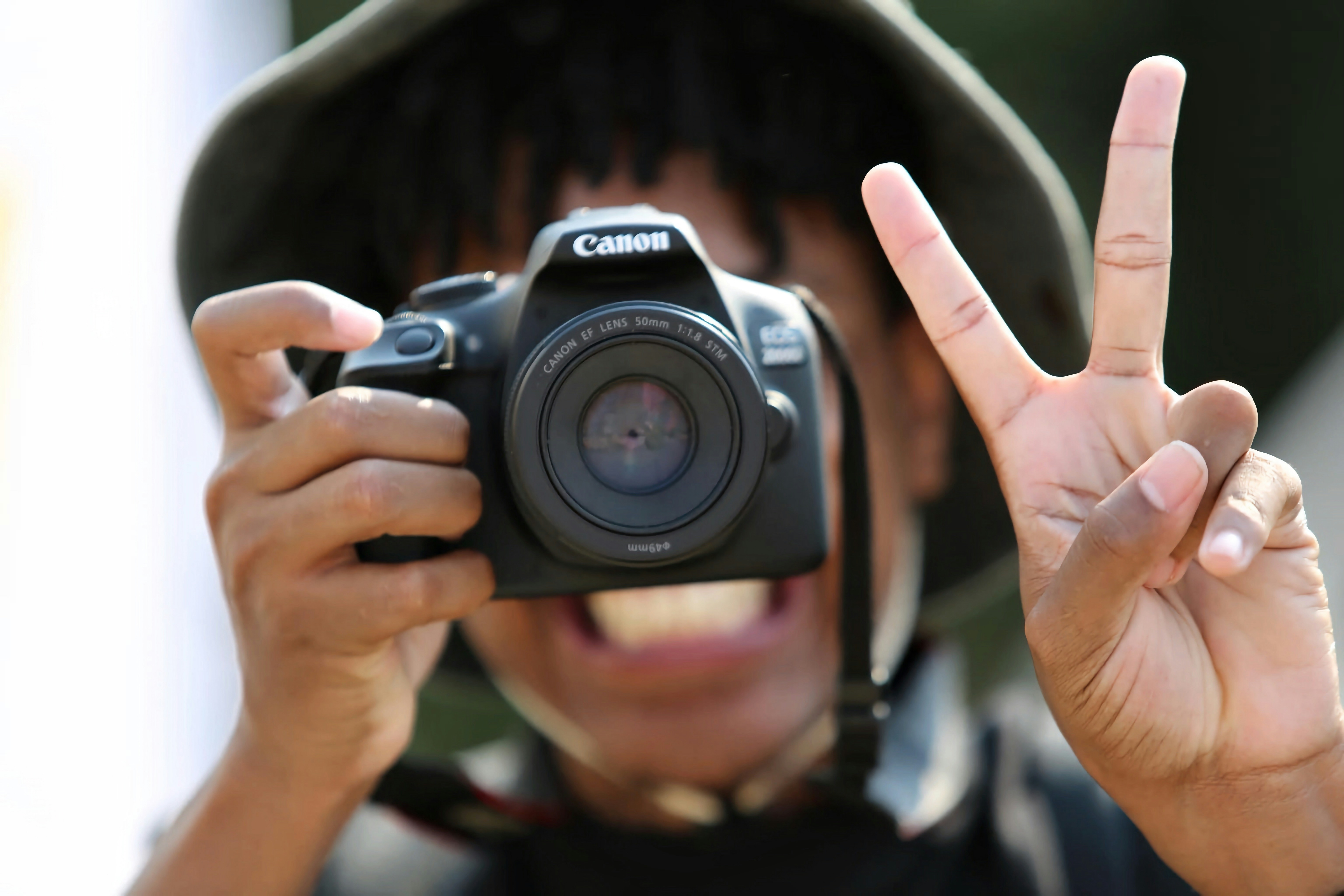 A person taking a picture with a camera