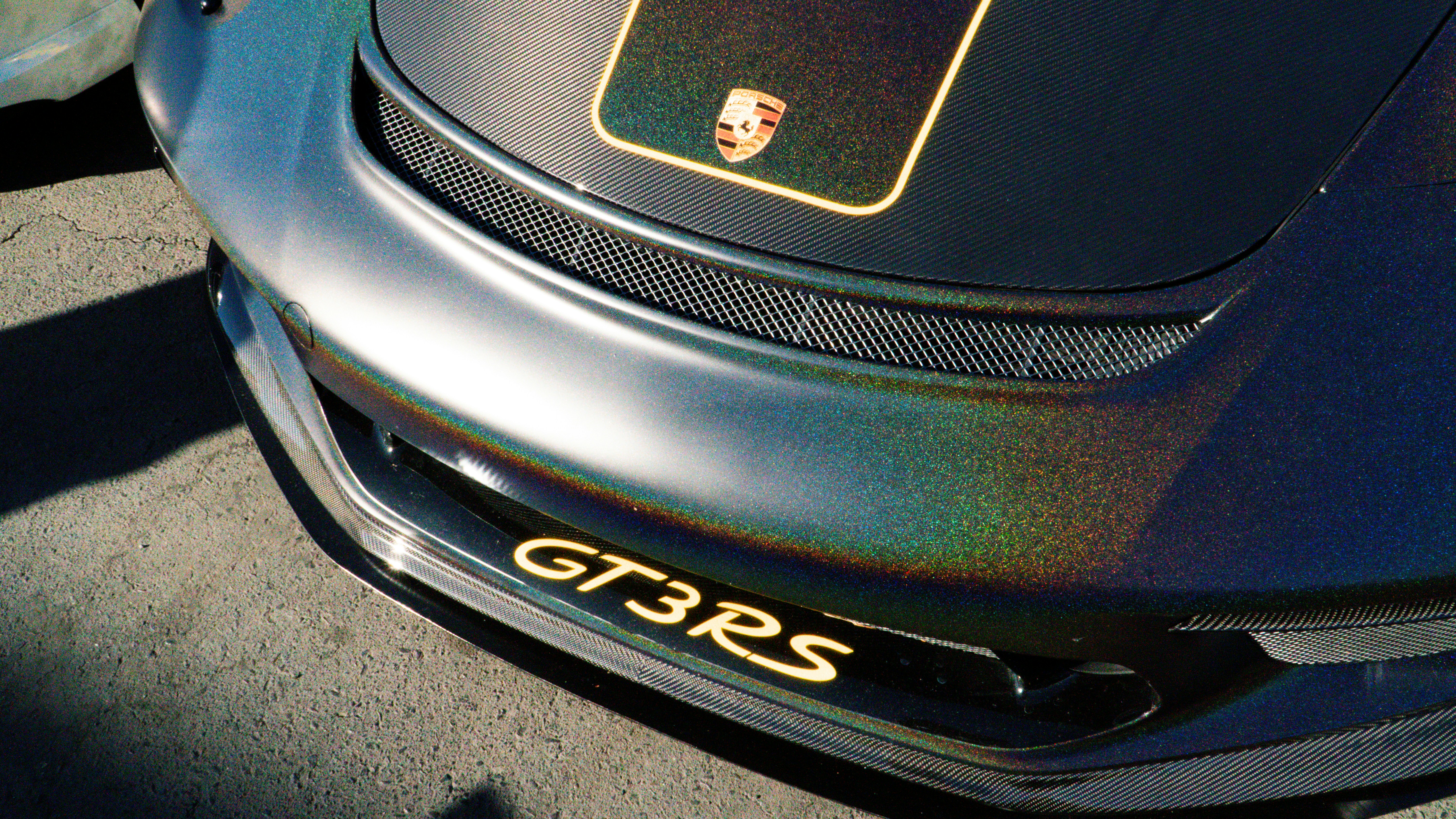 A close up of a black sports car