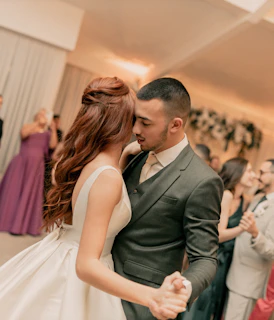 A bride and groom dancing at a wedding reception