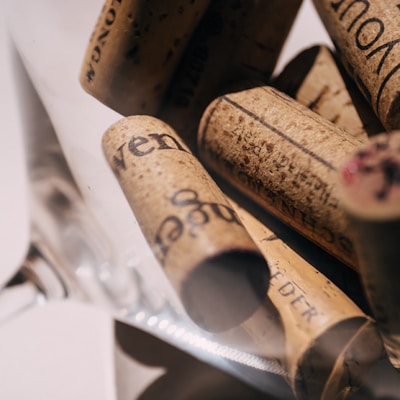 A bunch of wine corks in a glass container