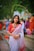 A woman in a red and white sari