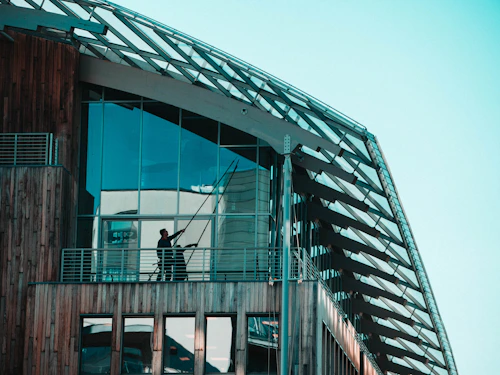 Cleaning windows on a building exterior