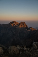 A view of a mountain range at sunset