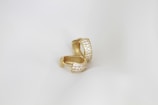 A close up of a ring on a white background