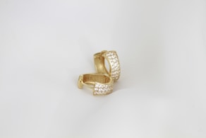 A close up of a ring on a white background