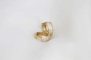 A close up of a ring on a white background
