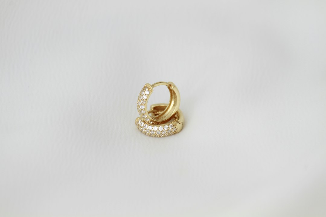 Curated ear stack combining huggies and studs Curated ear stack combining huggies and studs