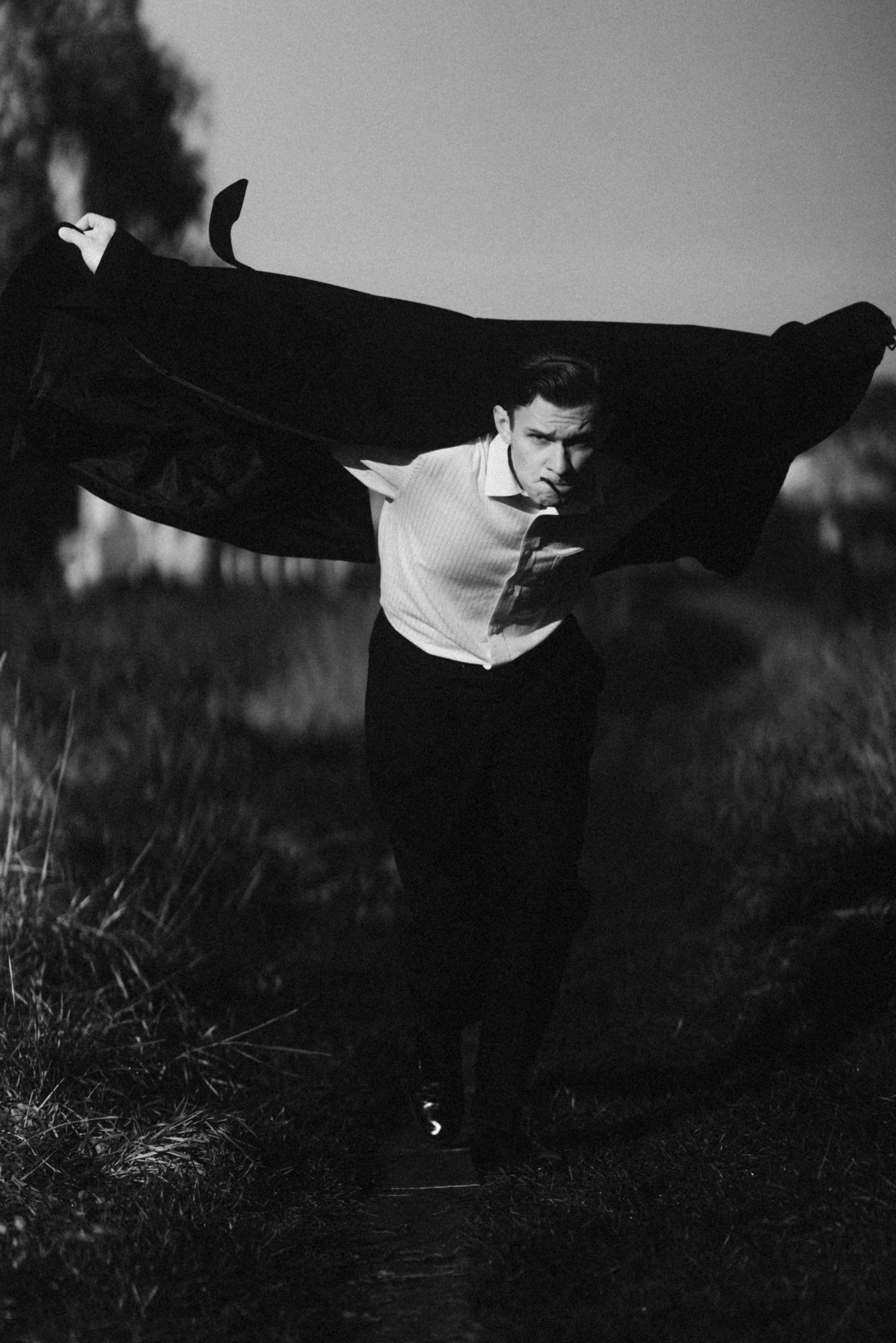 A man holding a large piece of cloth in his hands