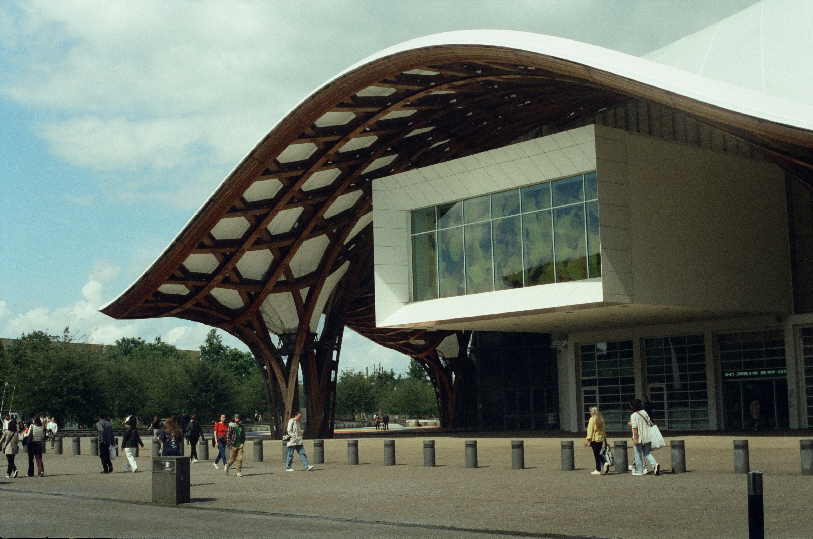 A group of people standing outside of a building