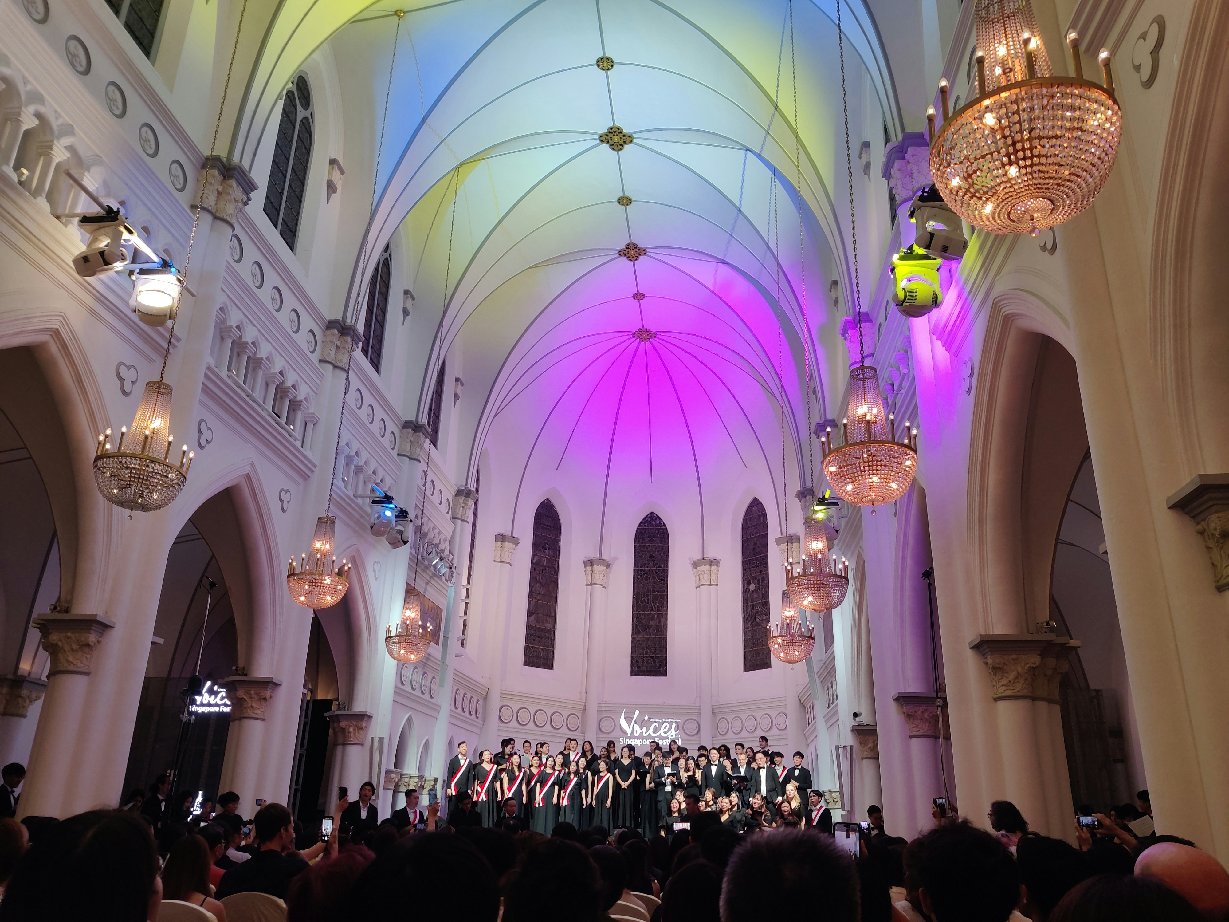 Church choir singing in vibrant worship service, bright stage lighting, diverse choir members