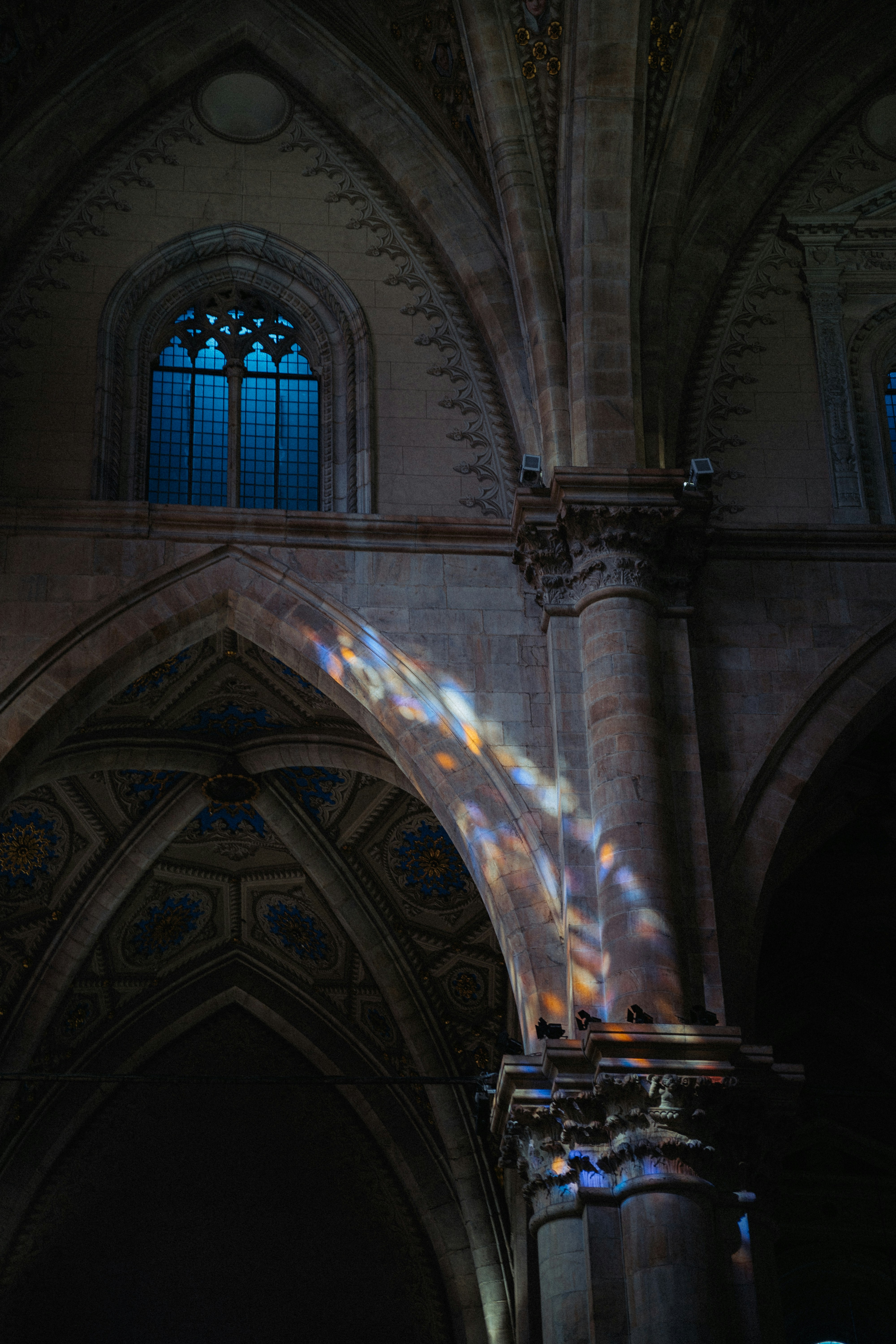 The sunlight is shining through the windows in the building