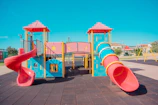 A playground with a slide and a play structure