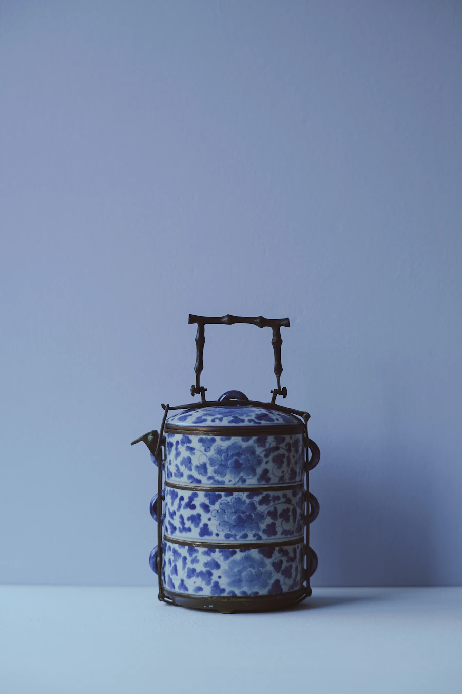 A stacked steel tiffin box packed for an office lunch