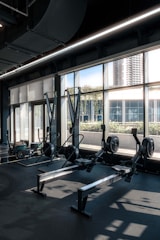 A gym with a row of exercise machines