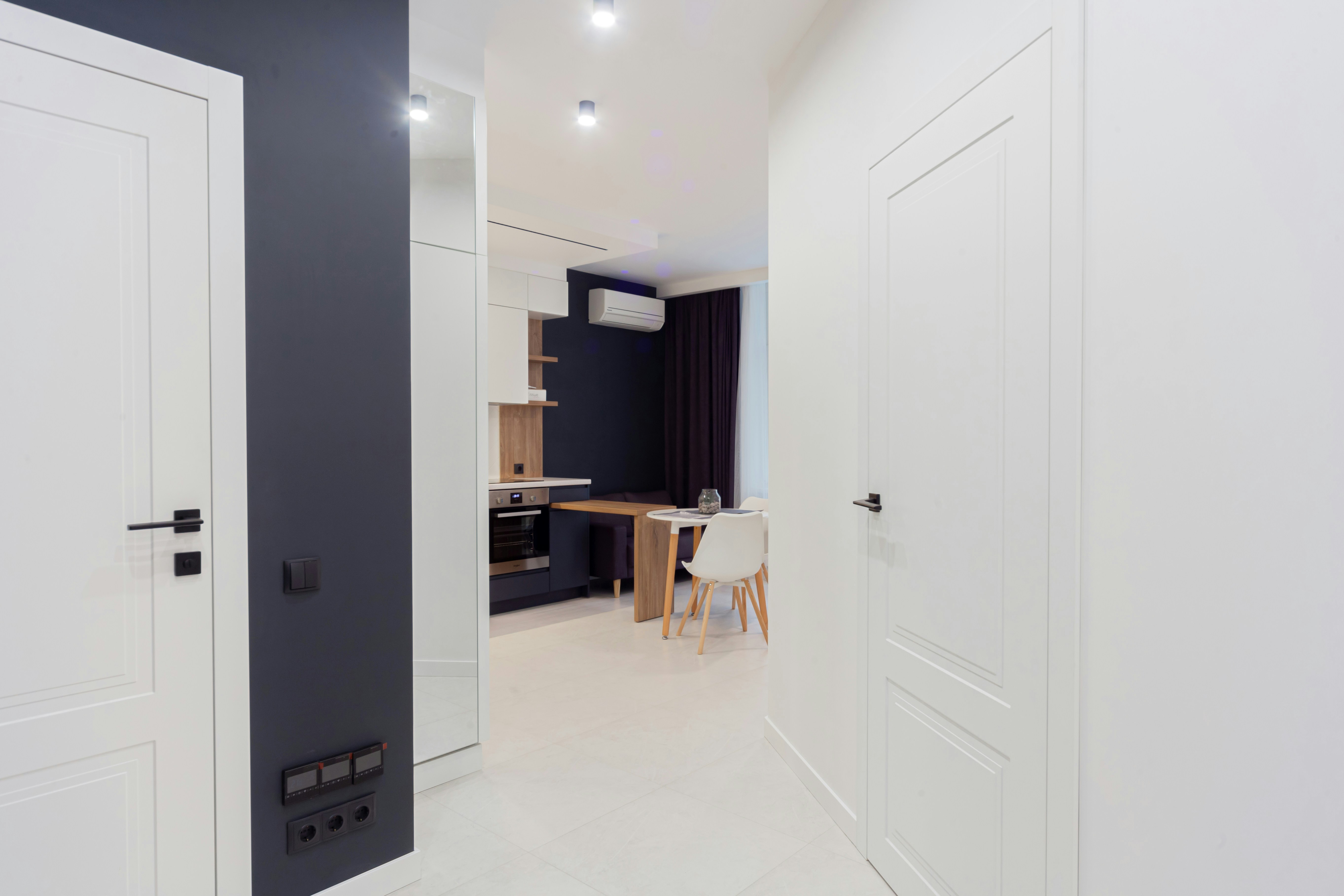 A room with two doors and a table in it