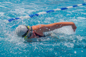A person swimming in a swimming pool