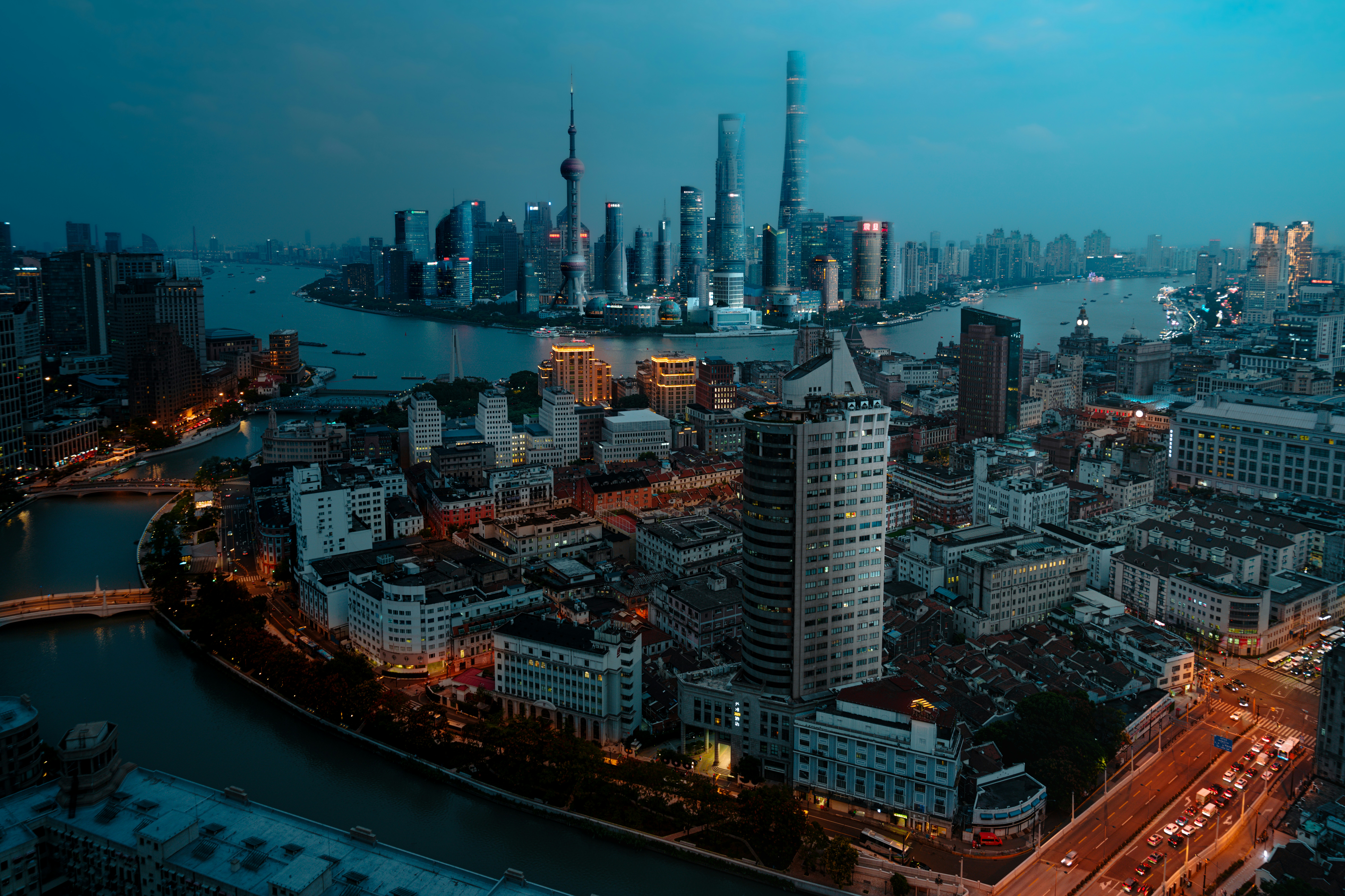 An aerial view of a city at night photo – Free Building Image on Unsplash