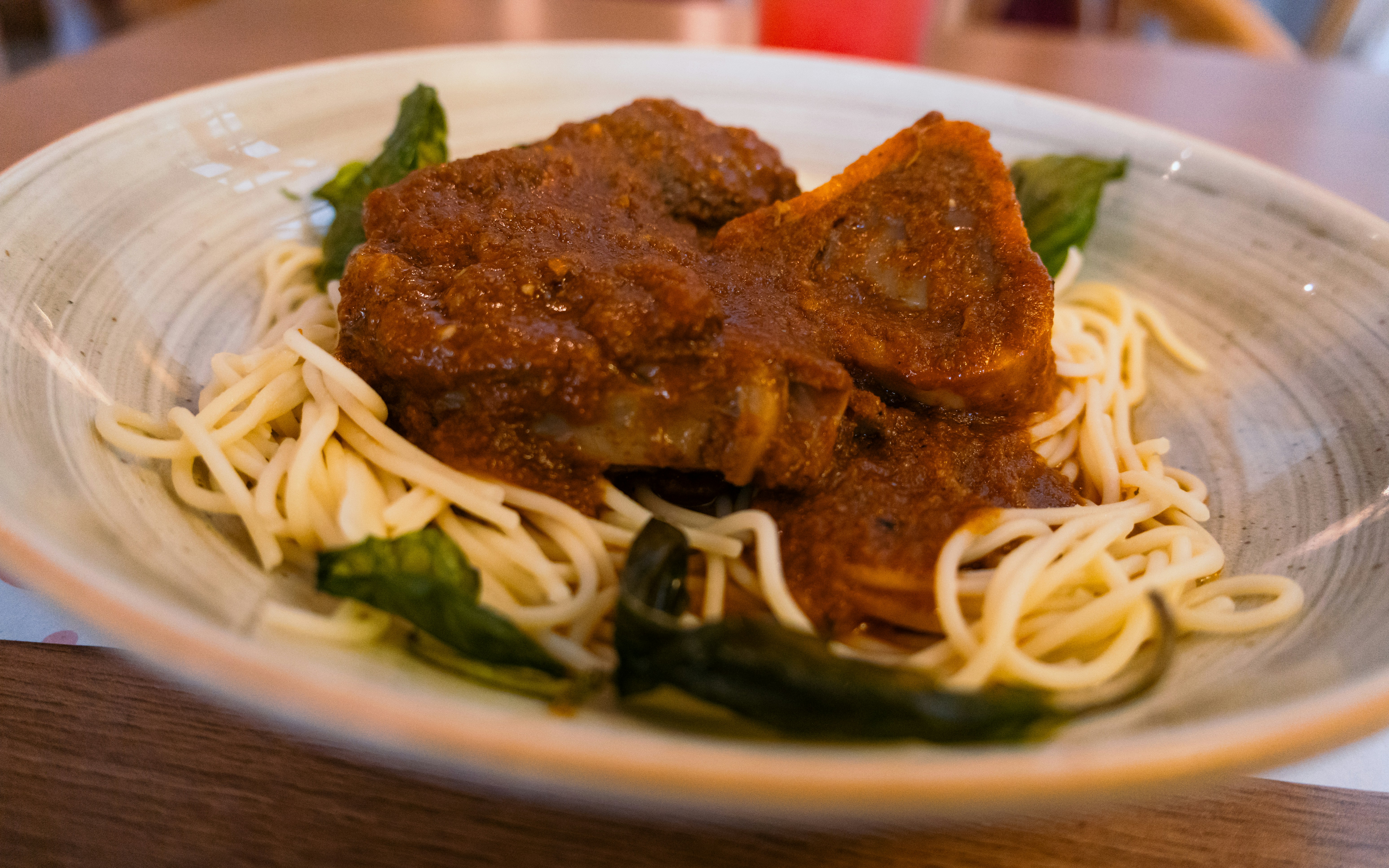 Spaghetti topped with slow-cooked meat