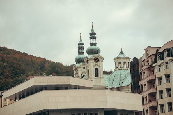A large building with a clock tower on top of it — Karlovy Vary, Czech Republic