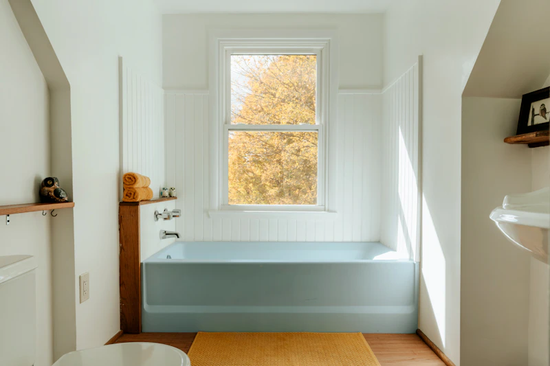 Non Slip Bath Mat in Appleton — Bathroom with a tub, sink and window