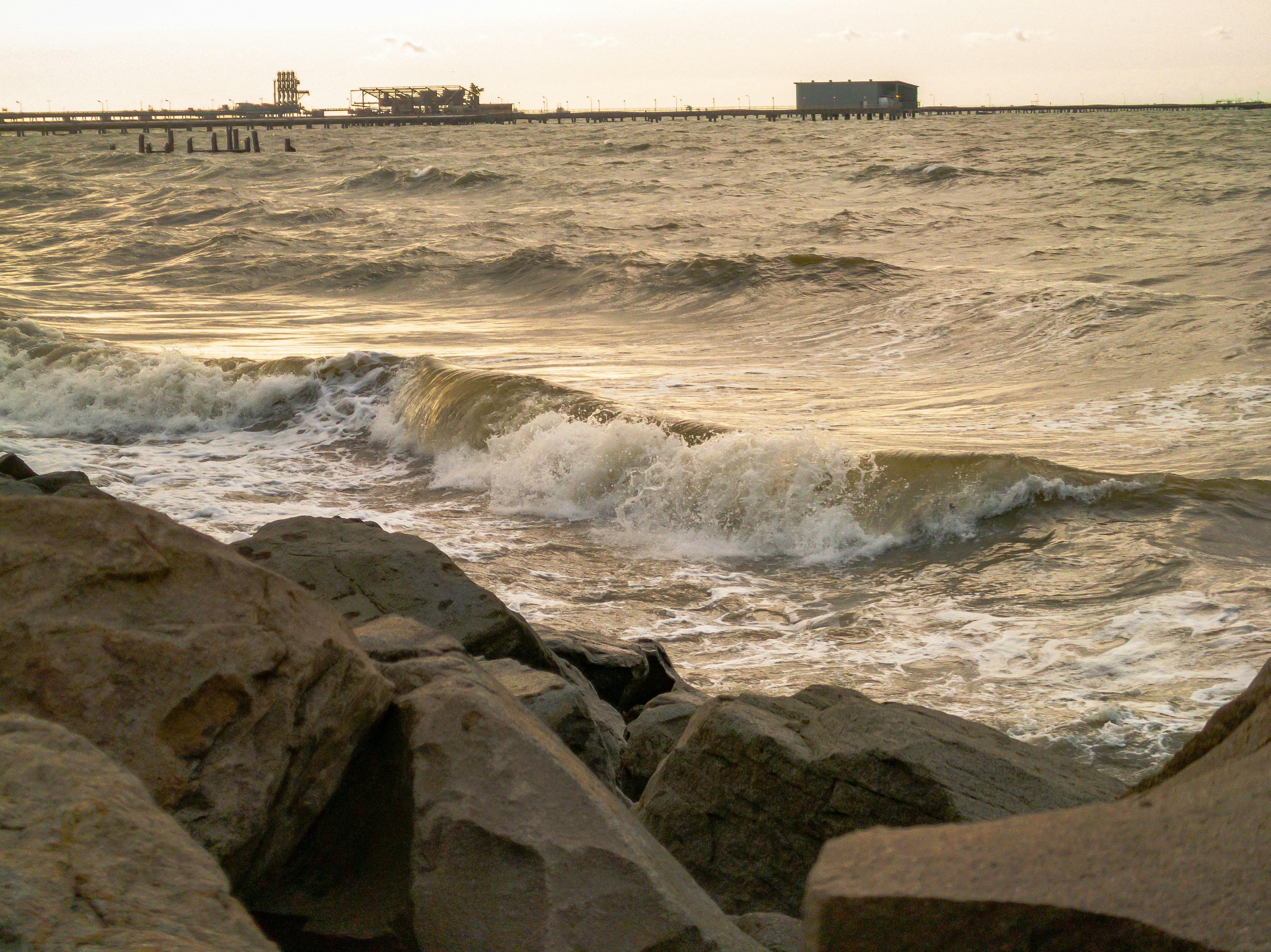 A view of a body of water with a boat in the distance