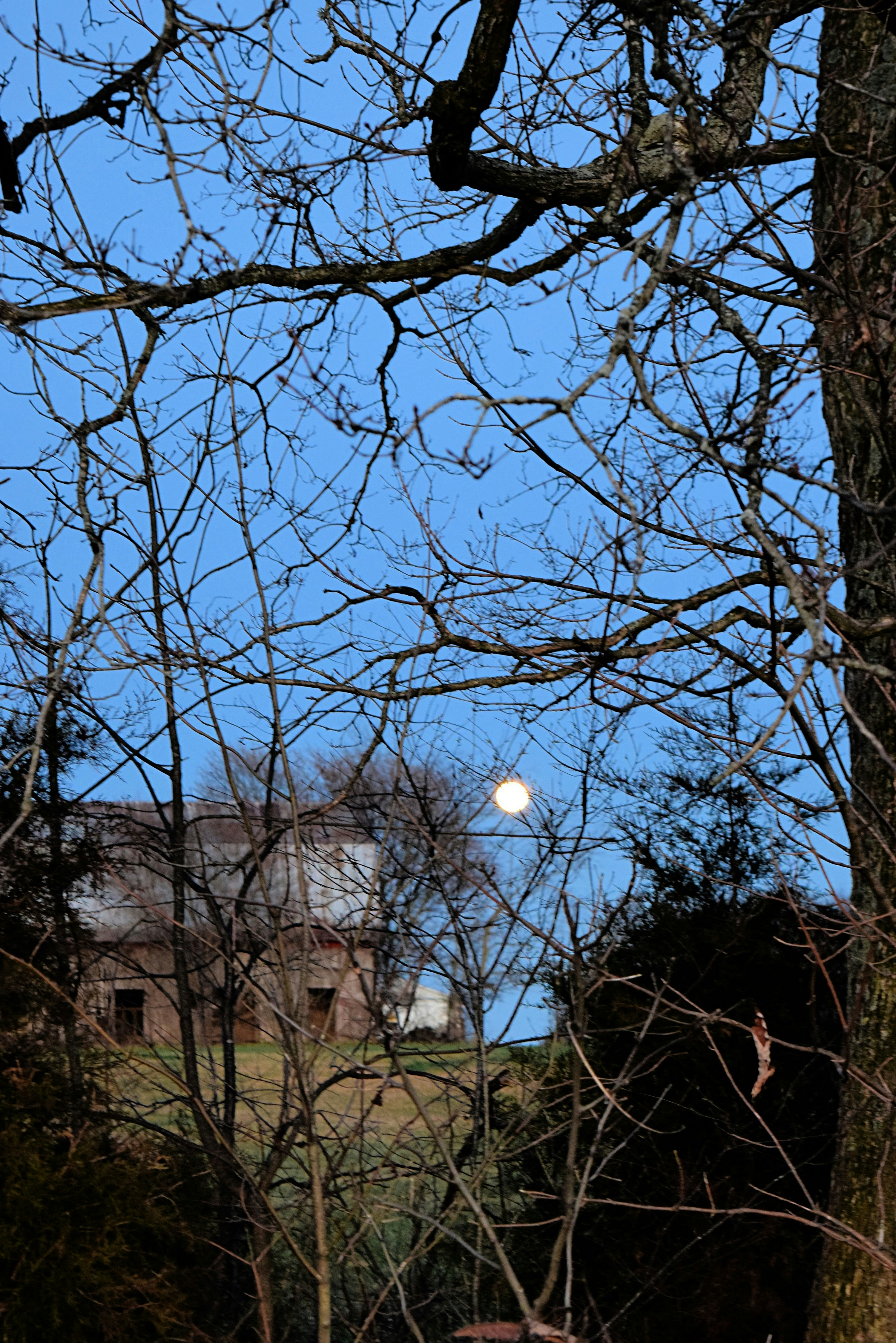 Indiana home at dusk under a full moon